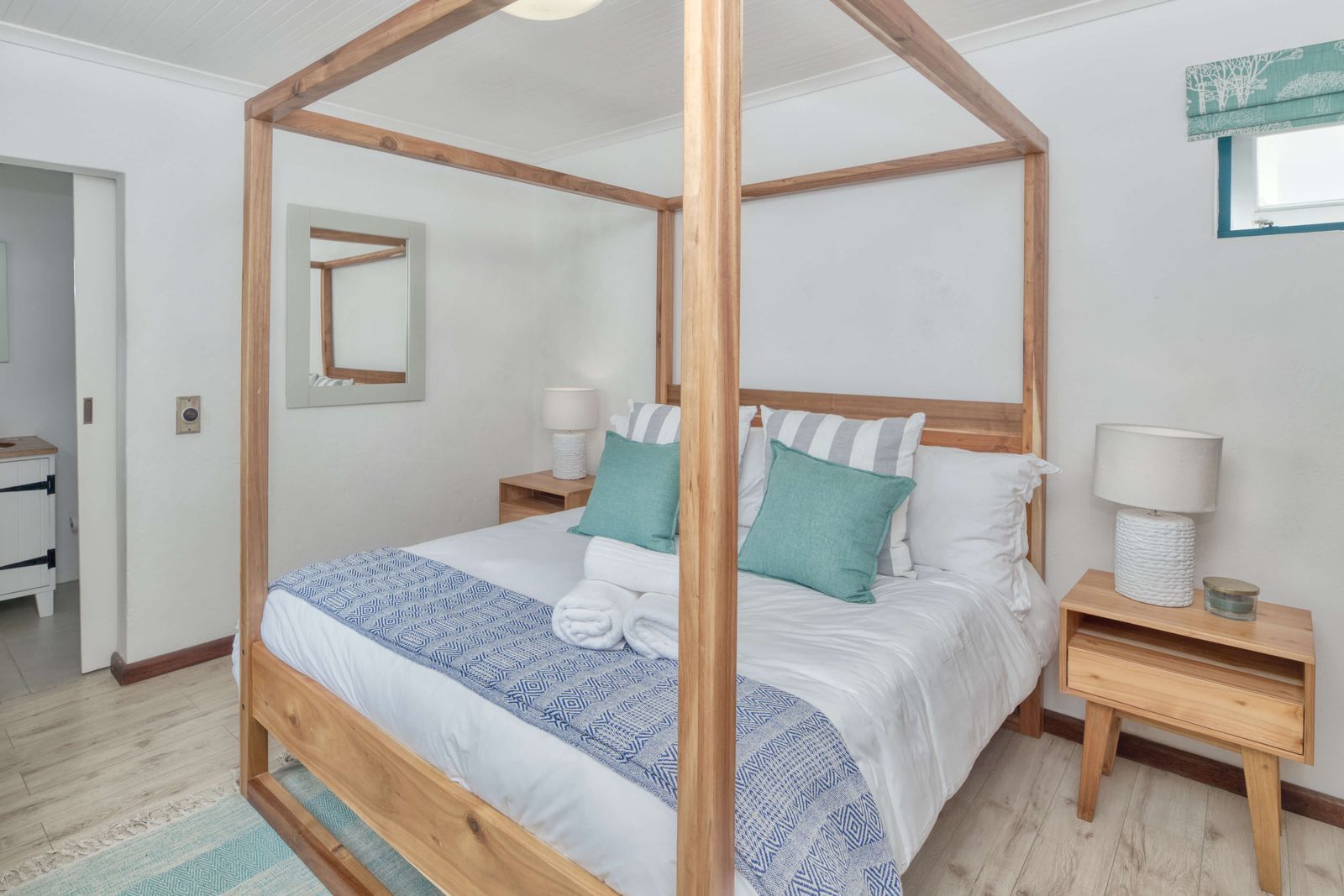 The Oceanpearl Room seen from the foot of the bed, the ensuite doorway on the left